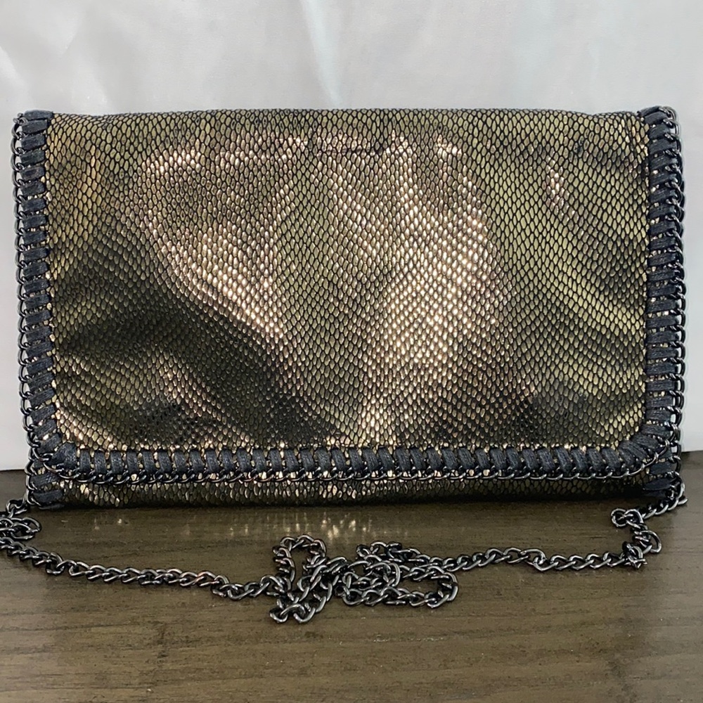 oversized clutch. Black and silver. used. Can be worn as a crossbody.